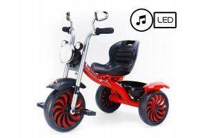 Piros zenélő, világító tricikli